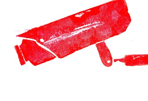 Grafika z czerwoną kamerą na białym tle.