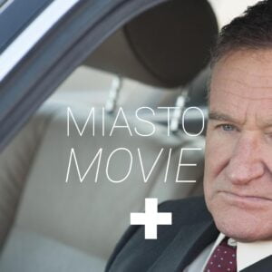 A shot from the film. Close-up of Robin Williams sitting in a car.